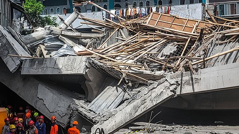 One person has been killed and 65 are buried under rubble after a boarding school building collapsed in Sidoarjo, Indonesia. Photograph: Fully Handoko/EPA