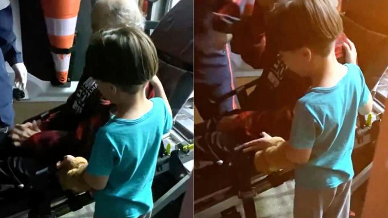 Menino de 7 anos pede ajuda a socorristas para seu avô (Foto: Reprodução)