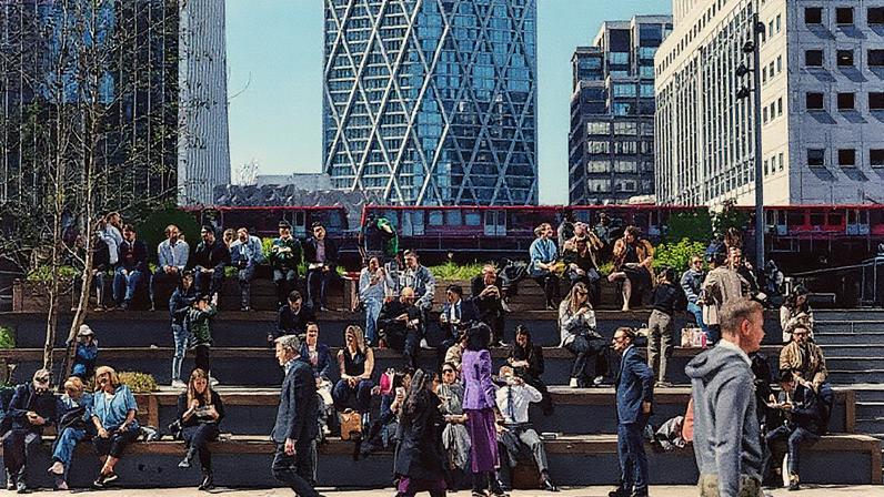 Pessoas aproveitam o almoço ao sol no distrito financeiro de Canary Wharf, em Londres (Foto: Reprodução)