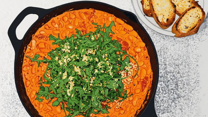 Prato de feijão-branco cremoso e picante com tomate seco e rúcula (Foto: Reprodução)