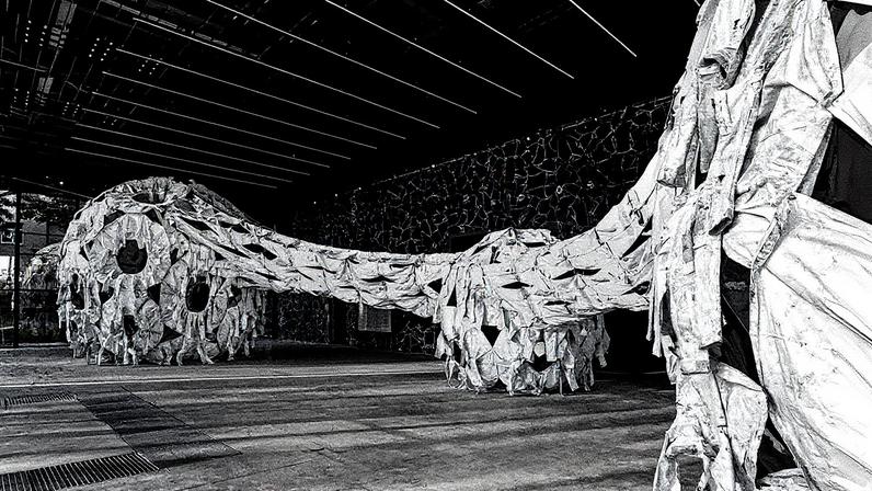 Ai Weiwei’s Three Perfectly Proportioned Spheres and Camouflage Uniforms Painted White (2025), commissioned by Ribbon International and on show at Pavilion 13 in Kyiv Photo: Dmytro Prutkin and Ribbon International