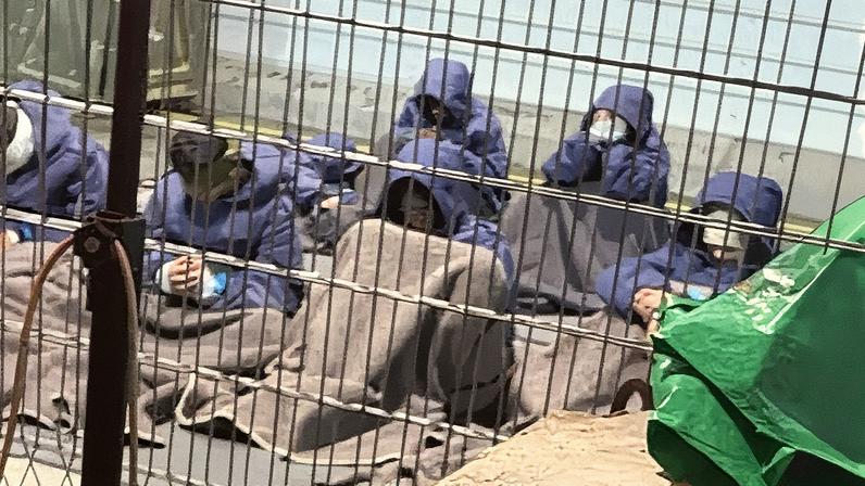 An undated photo from 2023 provided by a whistleblower shows Palestinian prisoners captured in the Gaza Strip at the Sde Teiman detention facility.