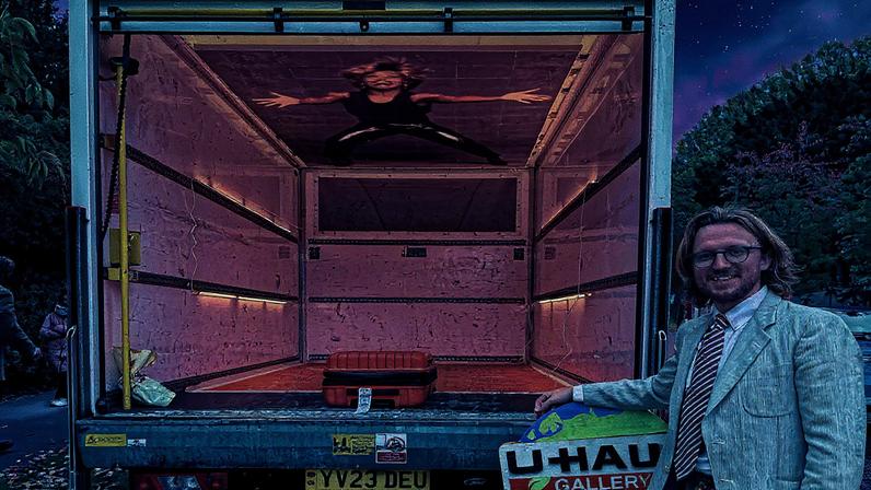 Gallery co-founder James Sundquist with the U-Haul Gallery Photo by Gareth Harris