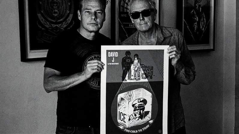Shepard Fairey and David J posing with a poster of the "Ice Too Cold to Thaw" single artwork