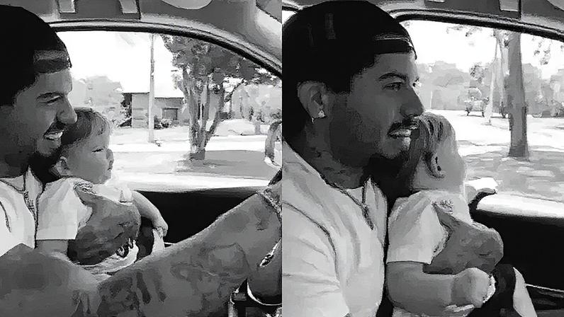 Zé Felipe dirigindo com o filho, José Leonardo, no colo — Foto: Reprodução/Instagram
