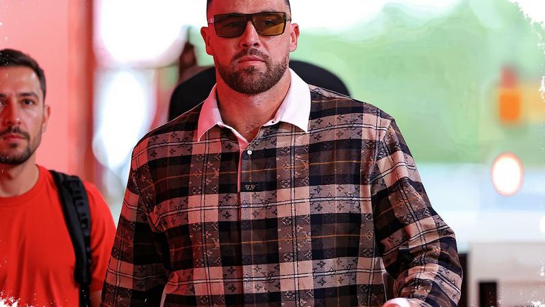 Travis Kelce wore a plaid Louis Vuitton shirt to his Kansas City Chiefs game Sunday. Getty Images
