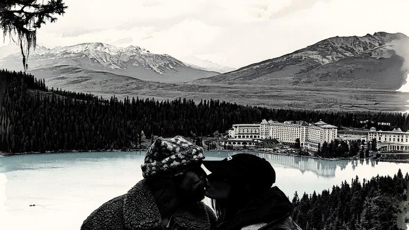 Justin Bieber shared a sweet snap of him kissing his wife, Hailey, against a stunning backdrop. Instagram/lilbieber