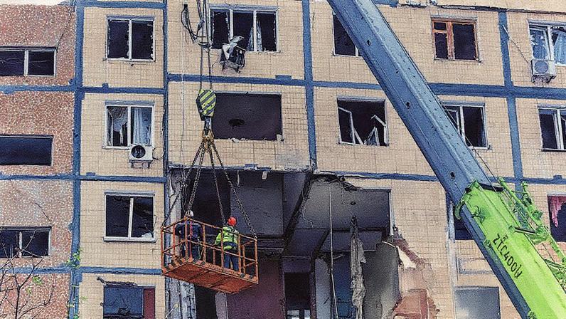 Rescuers work on an apartment building where three people died after a Russian drone strike in Dnipro. Photograph: Mykola Synelnykov/Reuters