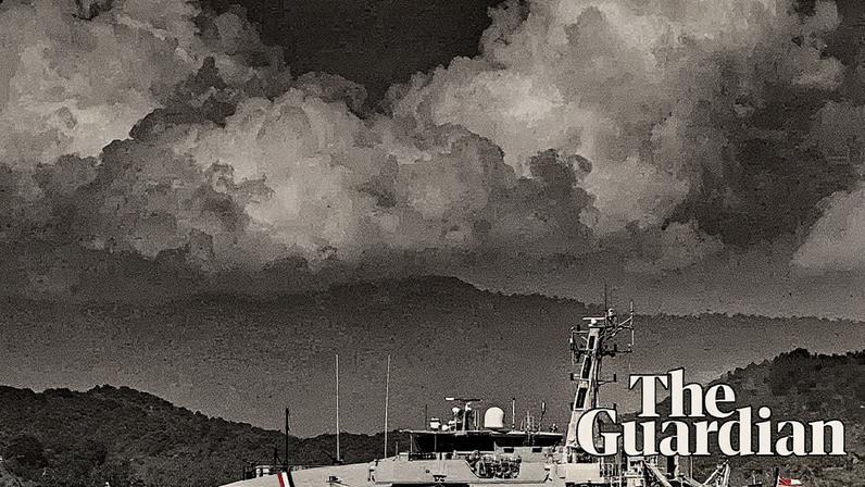 The Trinidad and Tobago coast guard (CG 41) vessel escorts the USS Gravely, a US navy warship, departing the port of Spain on 30 October 2025. Photograph: Martin Bernetti/AFP/Getty Images