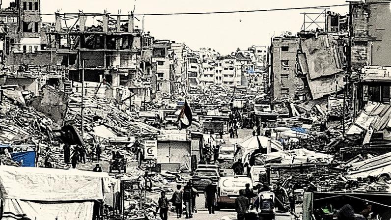 People walk among makeshift shelters and the ruins of buildings in Gaza City on Friday. Photograph: Mohammed Saber/EPA