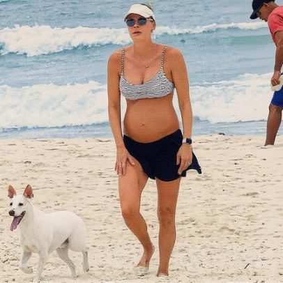 Grávida Betina Schmidt é vista caminhando na Barra da Tijuca