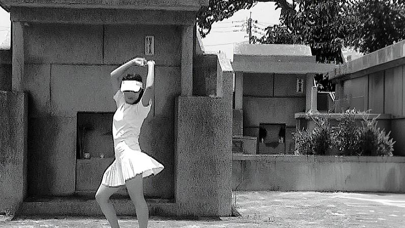In Okinawa Graveyard Club (2004), Chikako Yamashiro dances in front of family tombs © Chikako Yamashiro, courtesy of Yumiko Chiba Associates