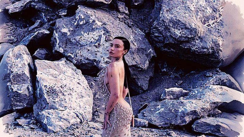 Demi Lovato posed in a plunging backless Amiri dress for her Who What Wear cover shoot in the California desert. Agata Serge/ Who What Wear